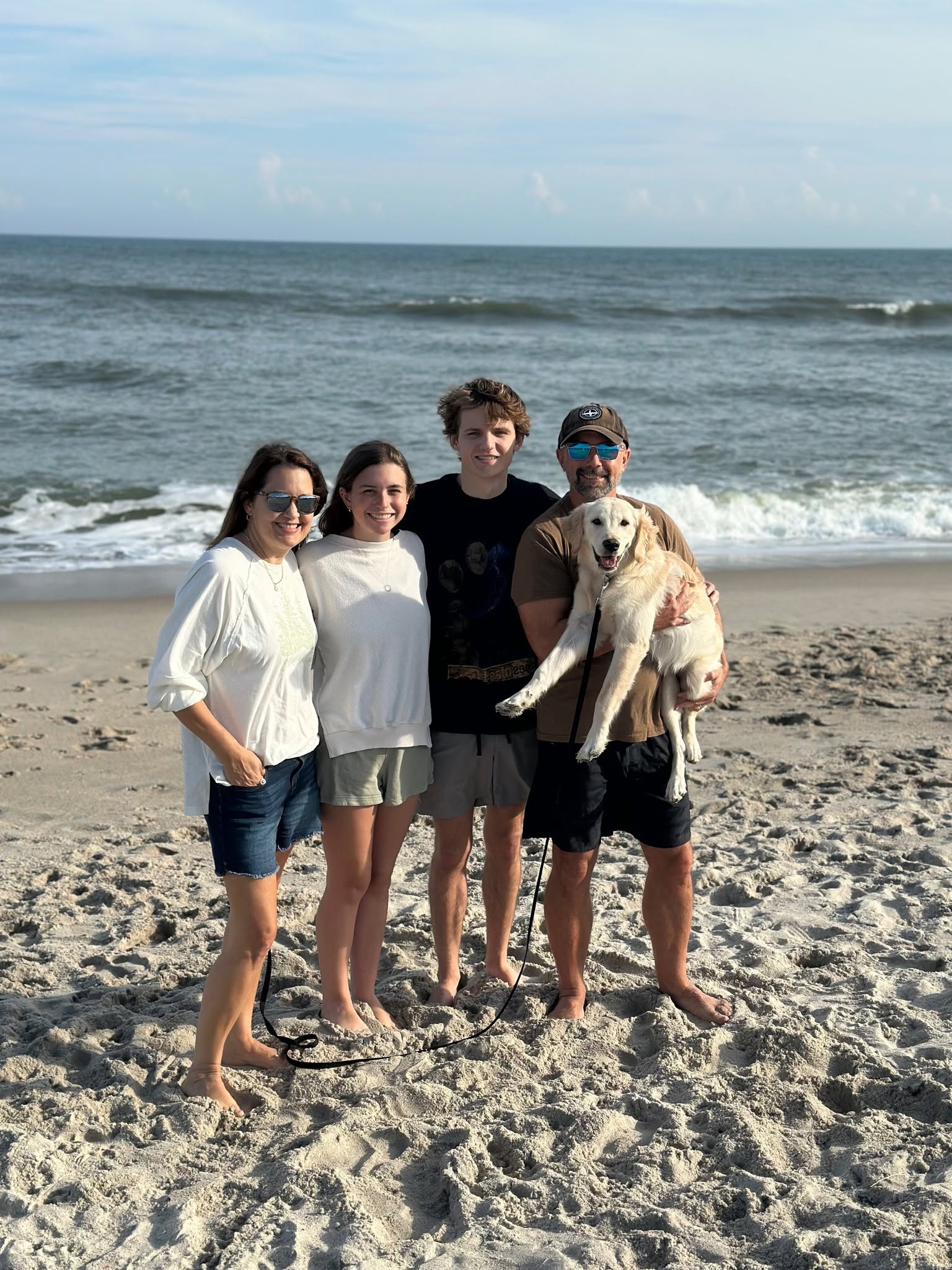 Scott Wittig with his family and Betty on the beach